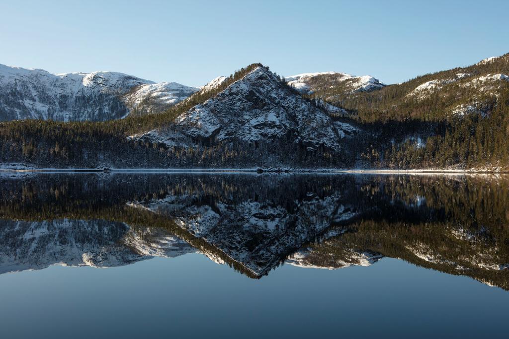 mountain by lake with reflection of the mountain in the lake